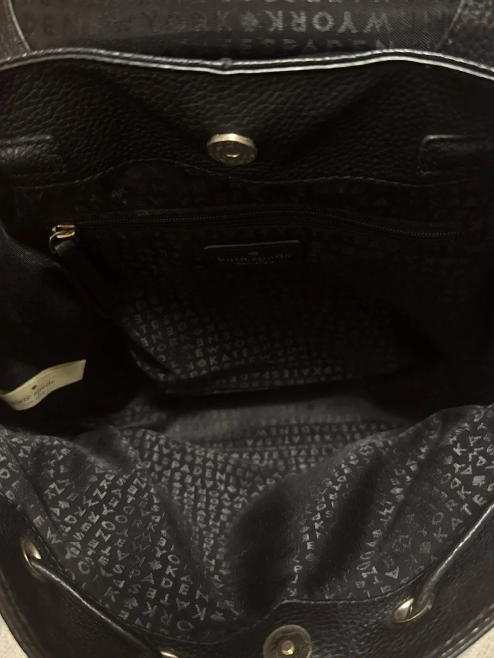 kate spade black pebbled leather flap drawstring backpack